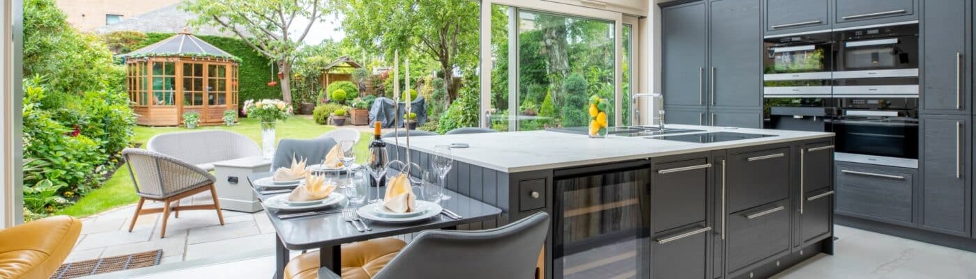 Open space kitchen area facing a garden